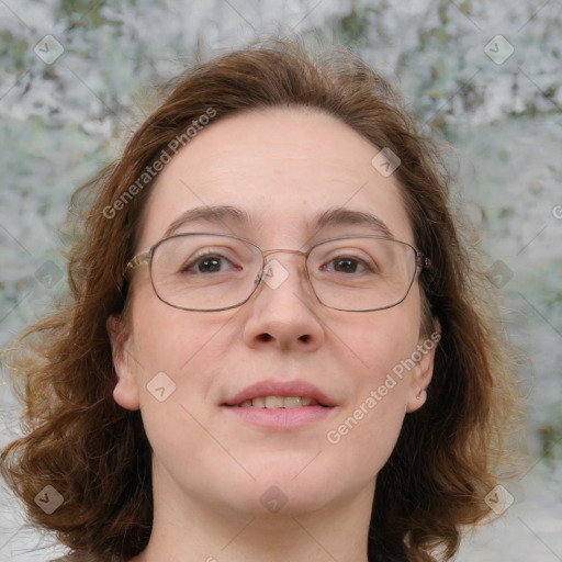 Joyful white adult female with medium  brown hair and blue eyes