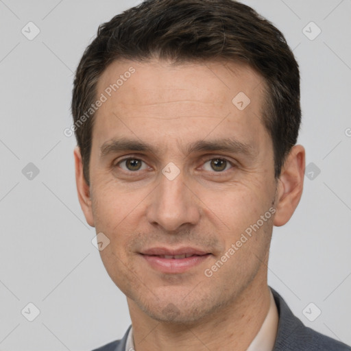 Joyful white adult male with short  brown hair and brown eyes