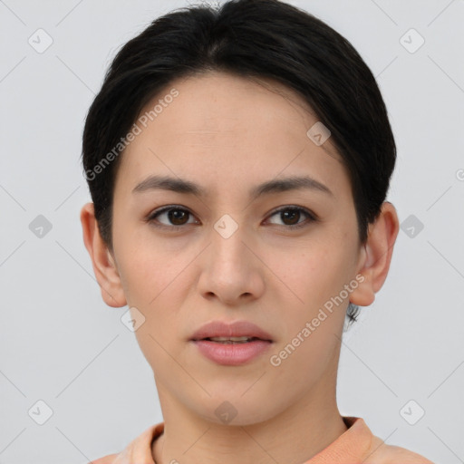 Joyful asian young-adult female with short  brown hair and brown eyes