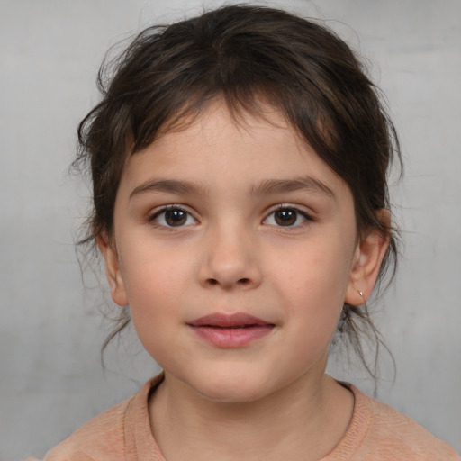 Joyful white child female with medium  brown hair and brown eyes