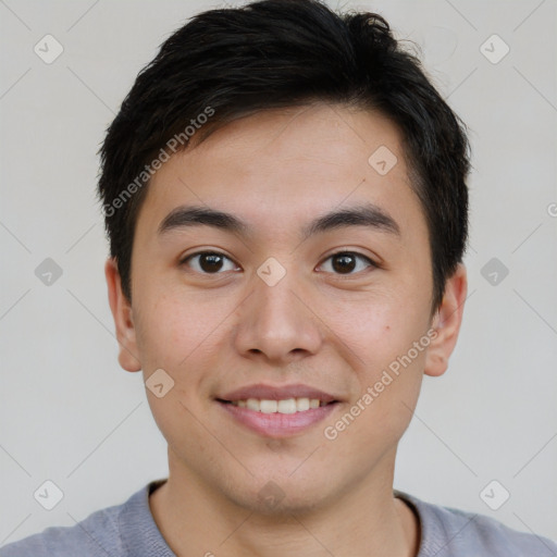 Joyful asian young-adult male with short  brown hair and brown eyes