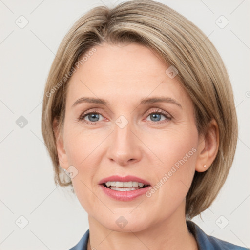 Joyful white adult female with medium  brown hair and grey eyes