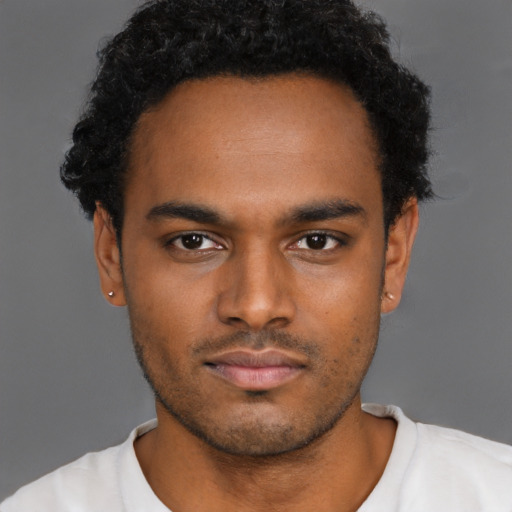 Neutral latino young-adult male with short  brown hair and brown eyes