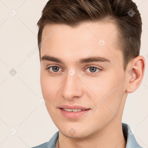 Joyful white young-adult male with short  brown hair and brown eyes