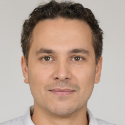 Neutral white adult male with short  brown hair and brown eyes