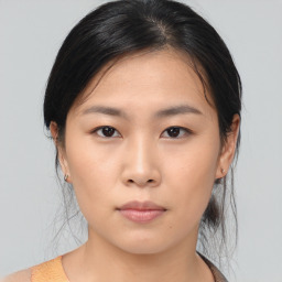 Neutral asian young-adult female with medium  brown hair and brown eyes