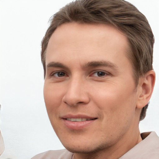 Joyful white young-adult male with short  brown hair and brown eyes