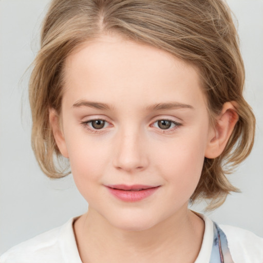 Joyful white child female with medium  brown hair and grey eyes