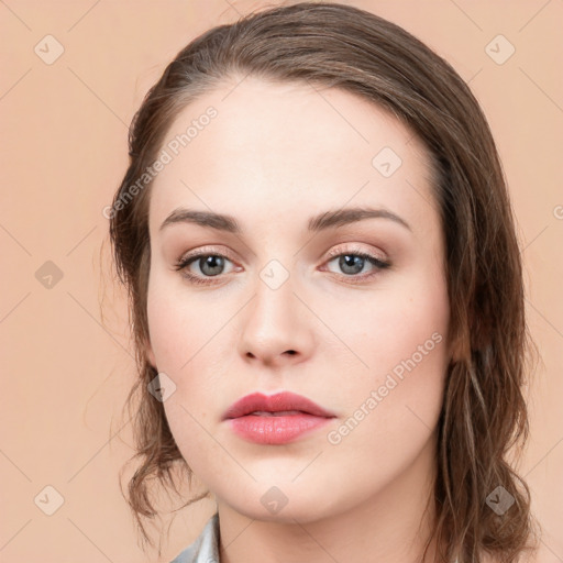 Neutral white young-adult female with long  brown hair and green eyes