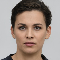 Neutral white young-adult female with short  brown hair and brown eyes