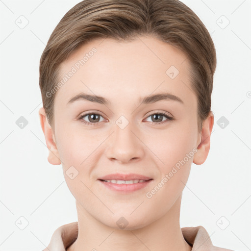 Joyful white young-adult female with short  brown hair and grey eyes