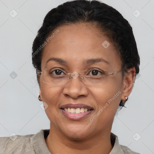 Joyful black adult female with short  brown hair and brown eyes