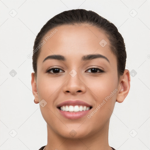 Joyful latino young-adult female with short  black hair and brown eyes