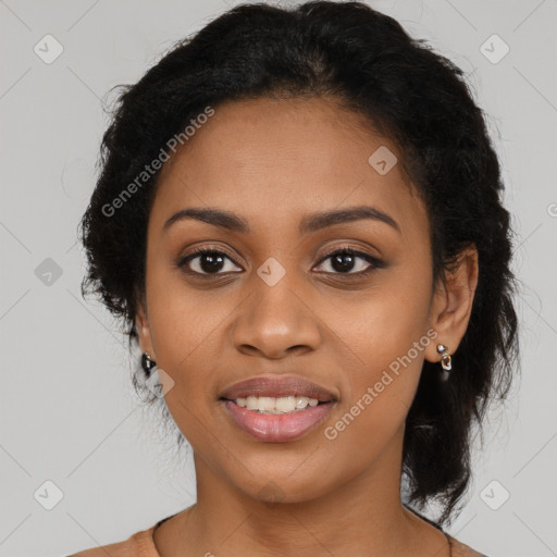 Joyful black young-adult female with long  black hair and brown eyes