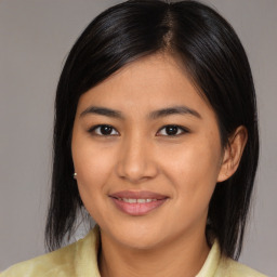 Joyful asian young-adult female with medium  black hair and brown eyes