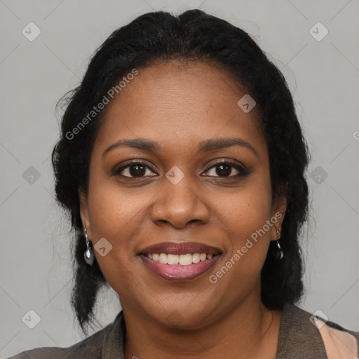 Joyful black young-adult female with long  brown hair and brown eyes