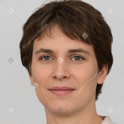 Joyful white young-adult female with short  brown hair and grey eyes