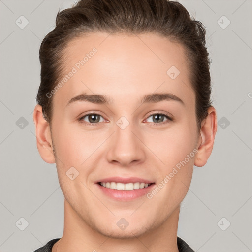 Joyful white young-adult female with short  brown hair and grey eyes