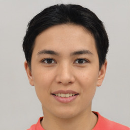 Joyful asian young-adult female with short  black hair and brown eyes