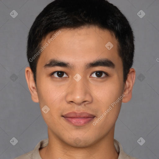 Joyful latino young-adult male with short  brown hair and brown eyes