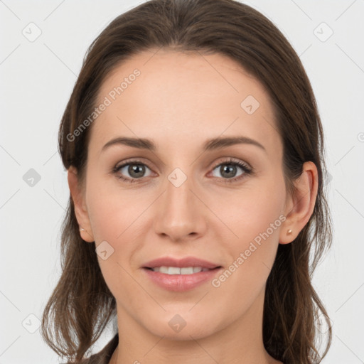 Joyful white young-adult female with long  brown hair and grey eyes