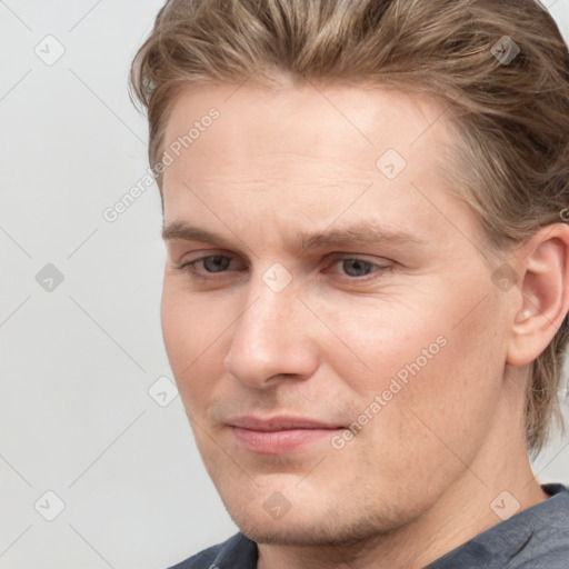 Joyful white adult male with short  brown hair and grey eyes