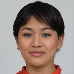 Joyful asian young-adult female with short  brown hair and brown eyes