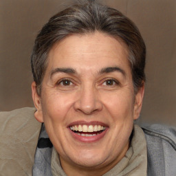 Joyful white adult female with short  brown hair and brown eyes