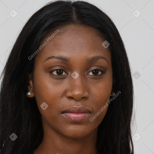 Joyful black young-adult female with long  brown hair and brown eyes