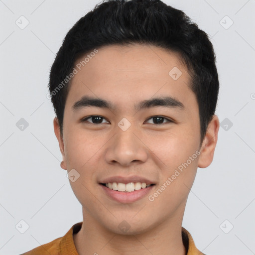 Joyful asian young-adult male with short  black hair and brown eyes