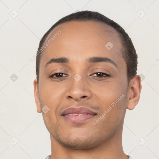 Joyful latino young-adult male with short  brown hair and brown eyes