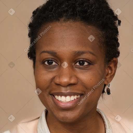 Joyful black young-adult female with short  brown hair and brown eyes