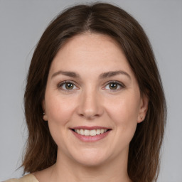 Joyful white young-adult female with medium  brown hair and brown eyes