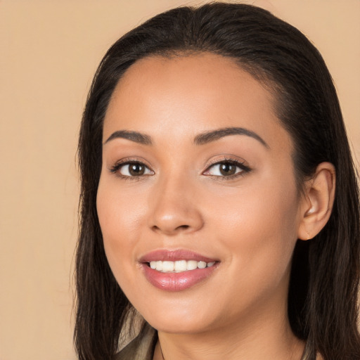 Joyful white young-adult female with long  brown hair and brown eyes