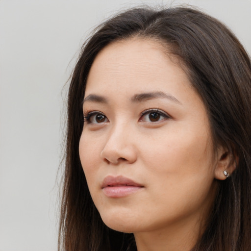 Neutral white young-adult female with long  brown hair and brown eyes