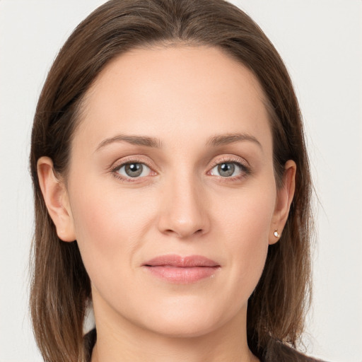 Joyful white young-adult female with long  brown hair and grey eyes