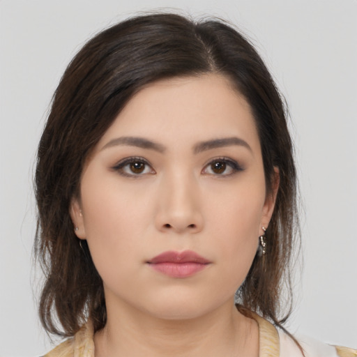 Neutral asian young-adult female with medium  brown hair and brown eyes