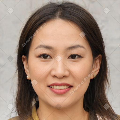 Joyful asian young-adult female with medium  brown hair and brown eyes