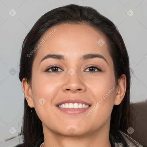 Joyful white young-adult female with long  black hair and brown eyes