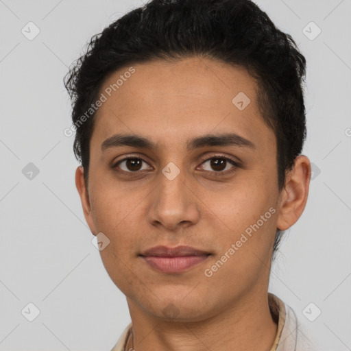 Joyful latino young-adult male with short  brown hair and brown eyes