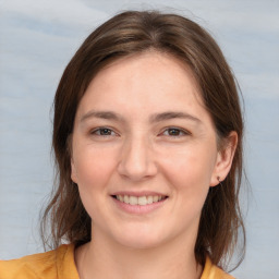 Joyful white young-adult female with medium  brown hair and brown eyes