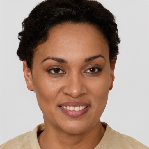 Joyful latino young-adult female with short  brown hair and brown eyes