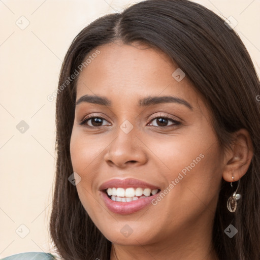 Joyful white young-adult female with long  brown hair and brown eyes