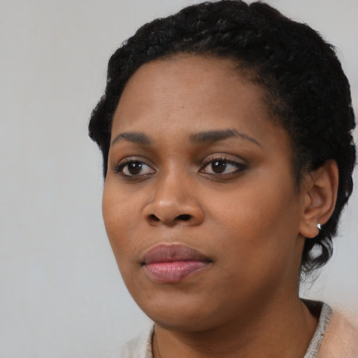 Neutral black young-adult female with short  black hair and brown eyes