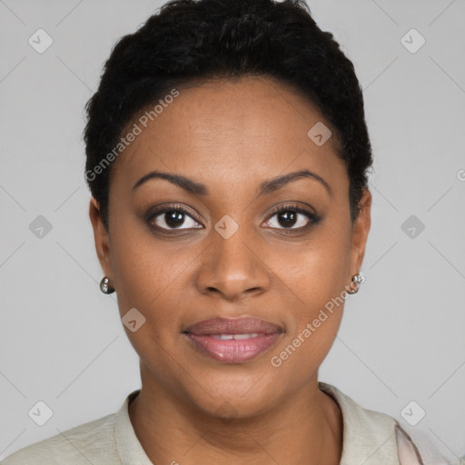 Joyful black young-adult female with short  black hair and brown eyes