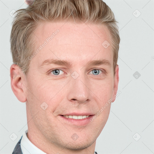 Joyful white young-adult male with short  brown hair and blue eyes