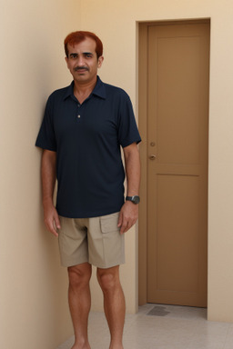 Emirati middle-aged male with  ginger hair