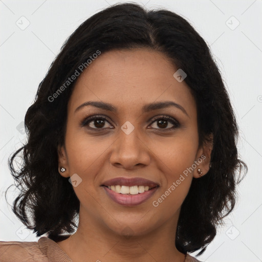 Joyful black young-adult female with long  brown hair and brown eyes