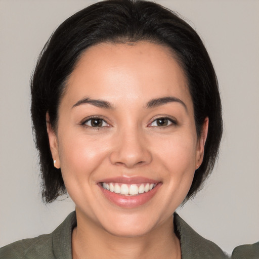 Joyful white young-adult female with medium  black hair and brown eyes