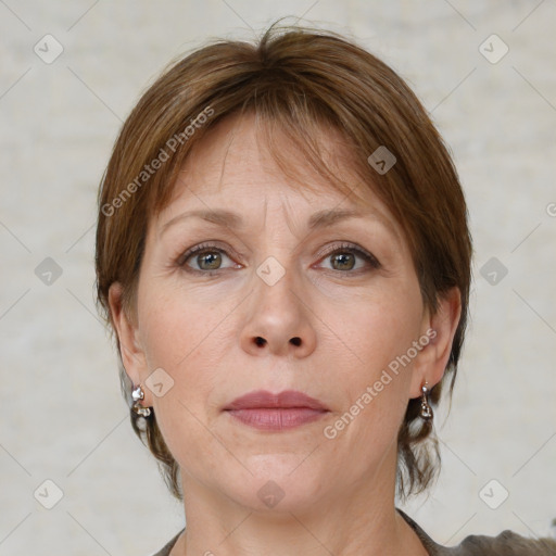 Joyful white adult female with medium  brown hair and grey eyes